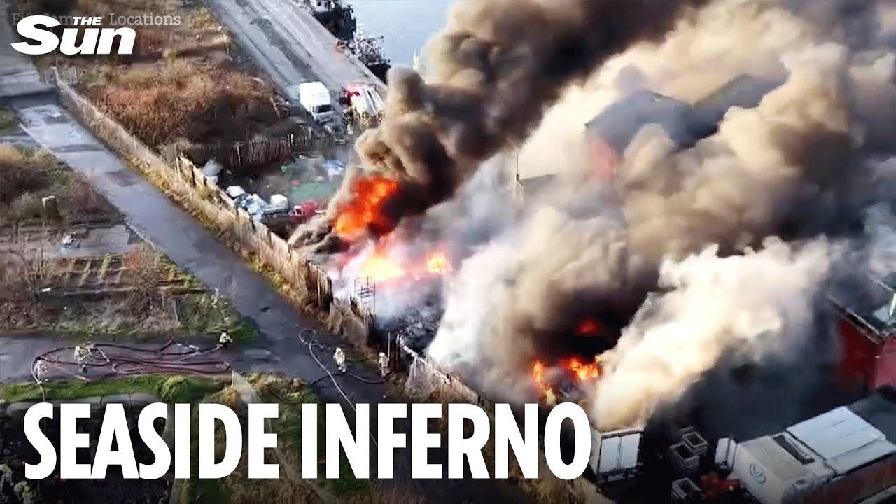 Massive fire erupts at UK harbour as several lorries go up in flames