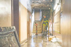 An FDNY investigator examines the scene where an 80-year-old victim died this month. An FDNY investigator examines the scene where an 80-year-old victim died this month.