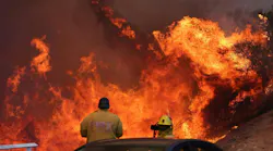 Firefighters were surrounded by raging flames in Palisades on Jan. 7, 2025.
