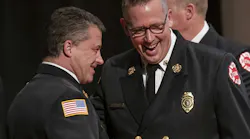 St. Paul Fire Chief Butch Inks, right, shares a laugh with Assistant Chief Anthony Farina before the start of the St. Paul Fire Academy Class of 2025-B graduation ceremony last month.