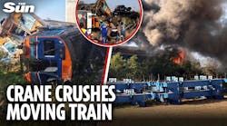 Crane CRASHES into moving train sparking major fire killing at least 25 Crane CRASHES into moving train sparking major fire killing at least 25