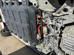 Shown: The battery pack assembly of the Chevrolet Bolt EV, with the connections and the coolant lines from the battery management system (BMS) exposed. When an EV winds up on its side, the stabilization issue is exponentially considerable; the footprint of any vehicle that’s on its side is much smaller than one that’s on its tires, and the battery pack makes the load more eccentric, favoring one side of the vehicle. Shown: The battery pack assembly of the Chevrolet Bolt EV, with the connections and the coolant lines from the battery management system (BMS) exposed. When an EV winds up on its side, the stabilization issue is exponentially considerable; the footprint of any vehicle that’s on its side is much smaller than one that’s on its tires, and the battery pack makes the load more eccentric, favoring one side of the vehicle.