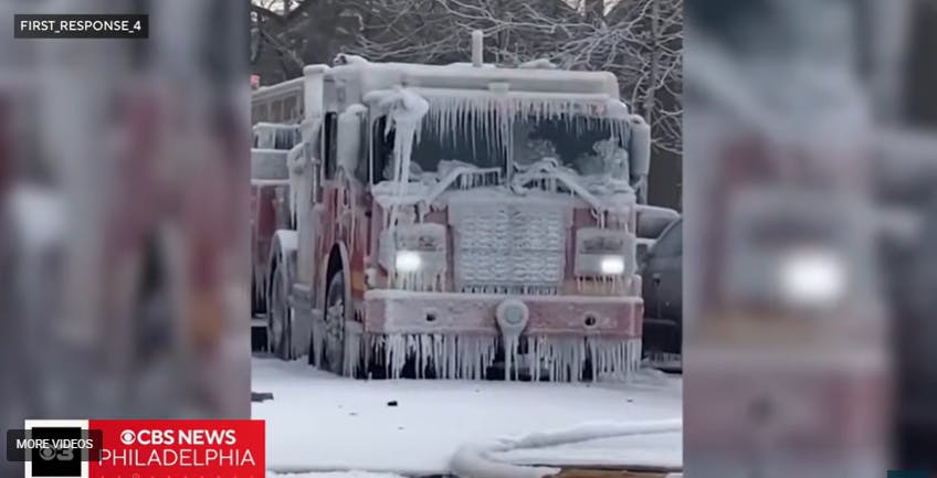 A Philadelphia rig is encased in ice during a structure fire.