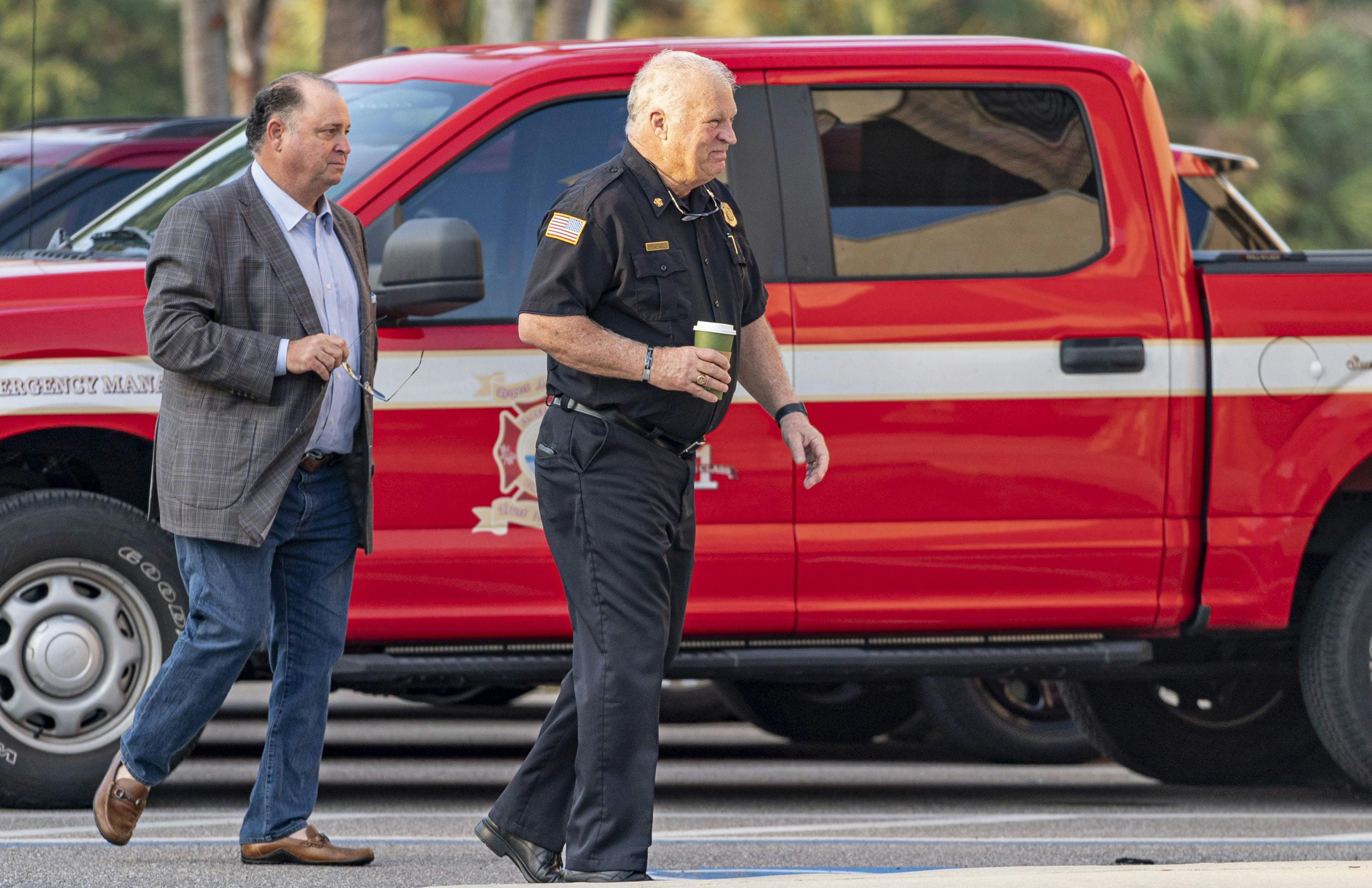 Retired St. Petersburg Fire Rescue Chief Jim Large, right, must notify stations about visits.
