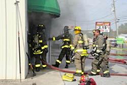 At this mattress warehouse fire, the incident safety officer, who is in full gear, is confirming accountability beyond the tags, including confirming who entered the immediately dangerous to life and health environment and those individuals’ time in for rules of air management (ROAM). This visual confirmation and face-to-face with the entry point officer is critical. If you look closely, you also can see a chief officer who is the rapid intervention team (RIT) chief. Span of control is critical when going offensive for a commercial building fire. At this mattress warehouse fire, the incident safety officer, who is in full gear, is confirming accountability beyond the tags, including confirming who entered the immediately dangerous to life and health environment and those individuals’ time in for rules of air management (ROAM). This visual confirmation and face-to-face with the entry point officer is critical. If you look closely, you also can see a chief officer who is the rapid intervention team (RIT) chief. Span of control is critical when going offensive for a commercial building fire.
