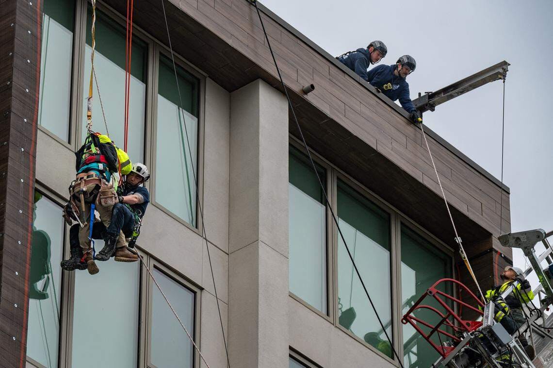 Two workers were rescued by Sacramento firefighters.