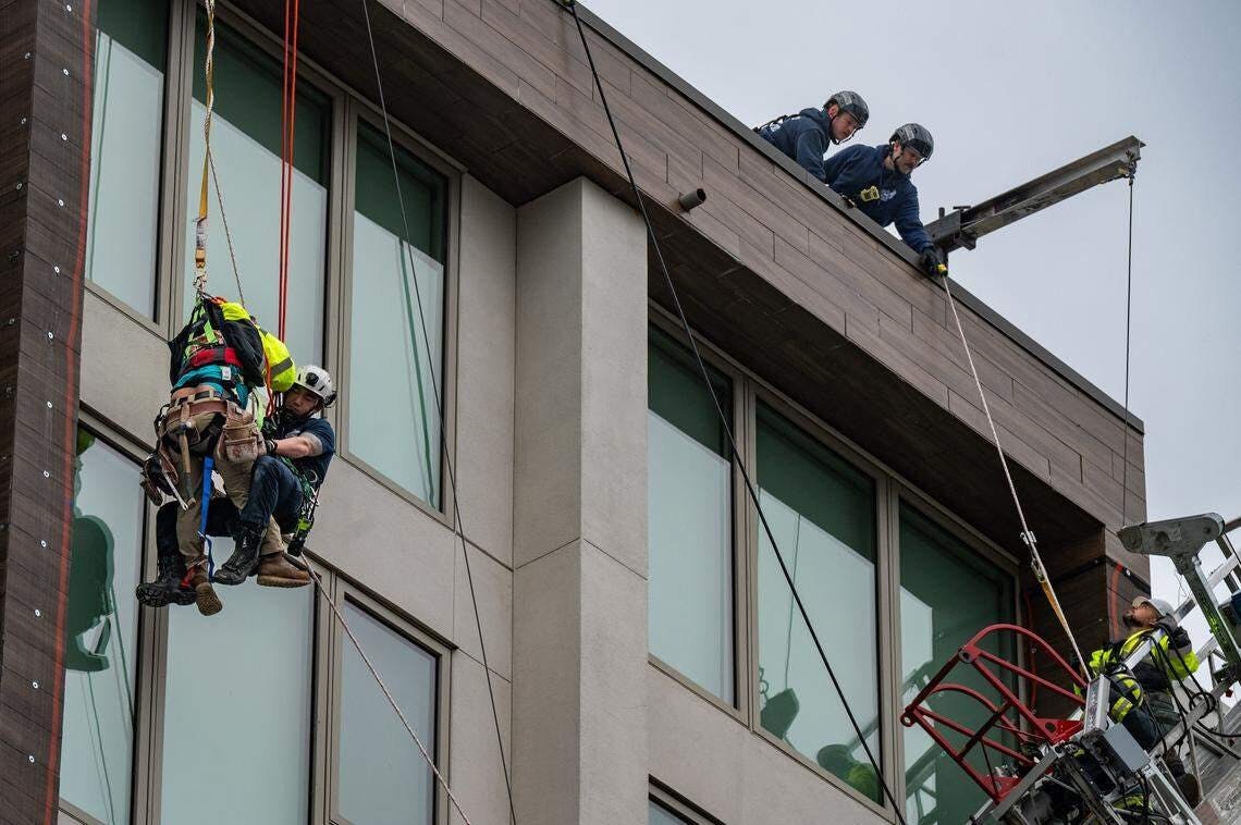 Two workers were rescued by Sacramento firefighters.
