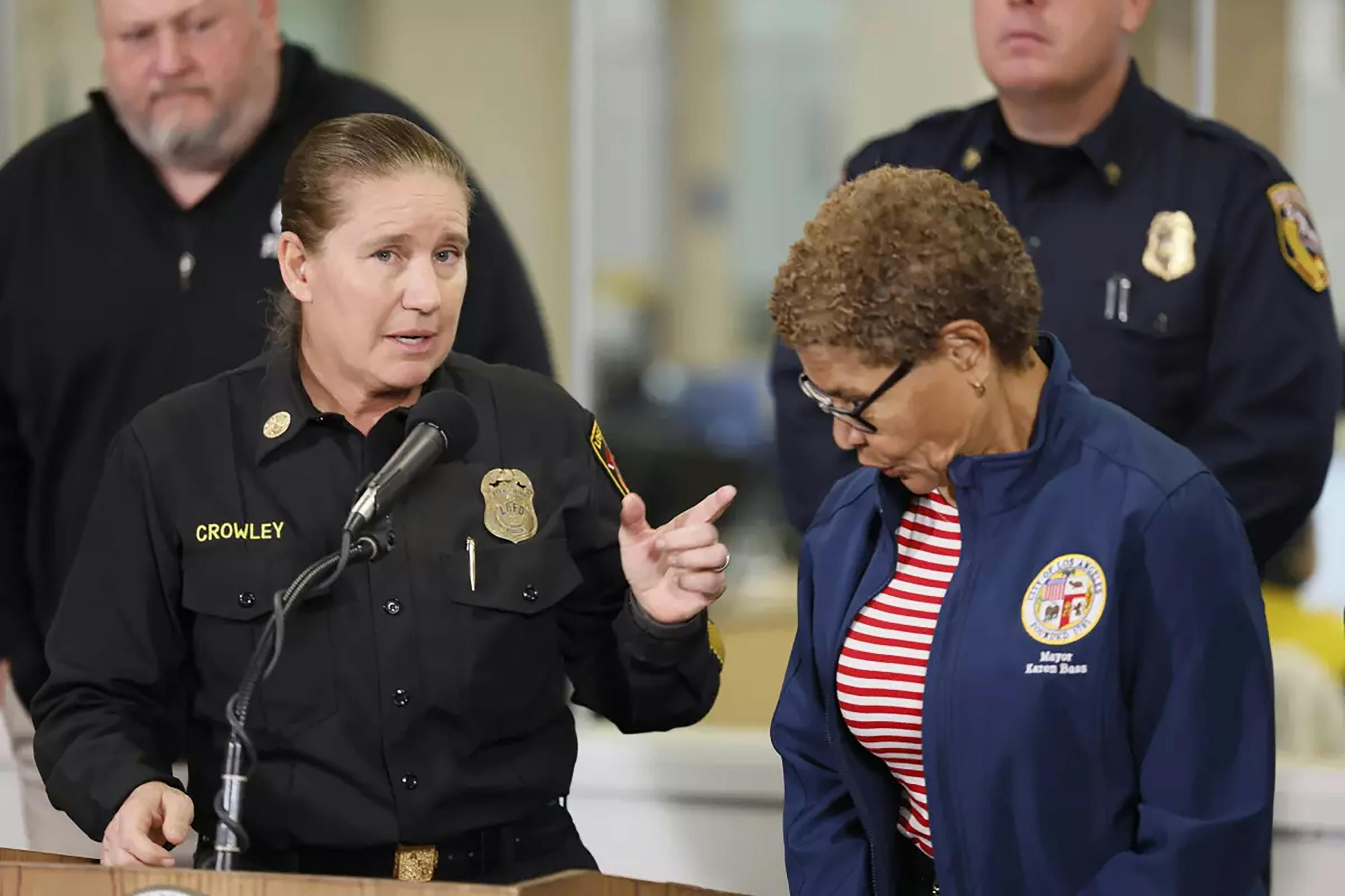 Ousted Los Angeles Fire Chief Krisinre Crowley accuses Mayor Karen Bass, right, of retaliation.