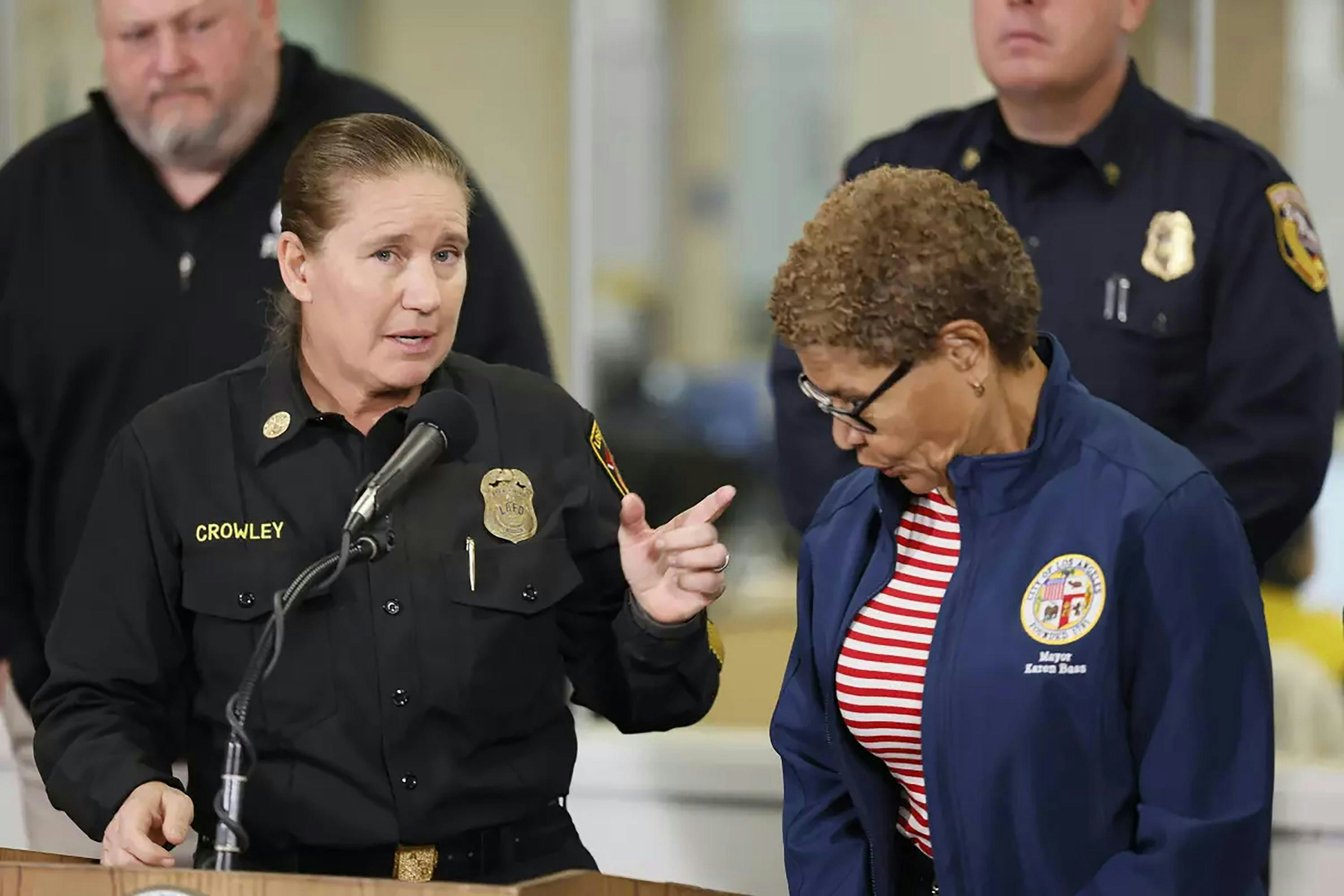 Ousted Los Angeles Fire Chief Krisinre Crowley accuses Mayor Karen Bass, right, of retaliation.