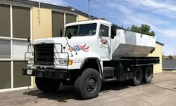An angle-shaped tank operates as water tender on a previous military Freightliner chassis in Black Eagle, MT. An angle-shaped tank operates as water tender on a previous military Freightliner chassis in Black Eagle, MT.