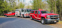 Local and state fire response apparatus operate at a vegetation fire with a structure threatened. Working together should be the standard operating mode in unified command. Local and state fire response apparatus operate at a vegetation fire with a structure threatened. Working together should be the standard operating mode in unified command.
