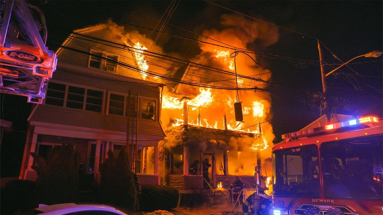 Vehicle Flips after Colliding with Newark, NJ, Fire Truck Responding to Two-Alarm Fire