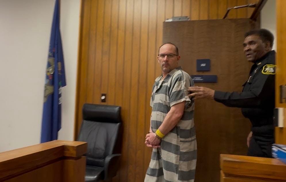 Former Saginaw County Firefighter Ryan M. Schilling walks into the courtroom.
