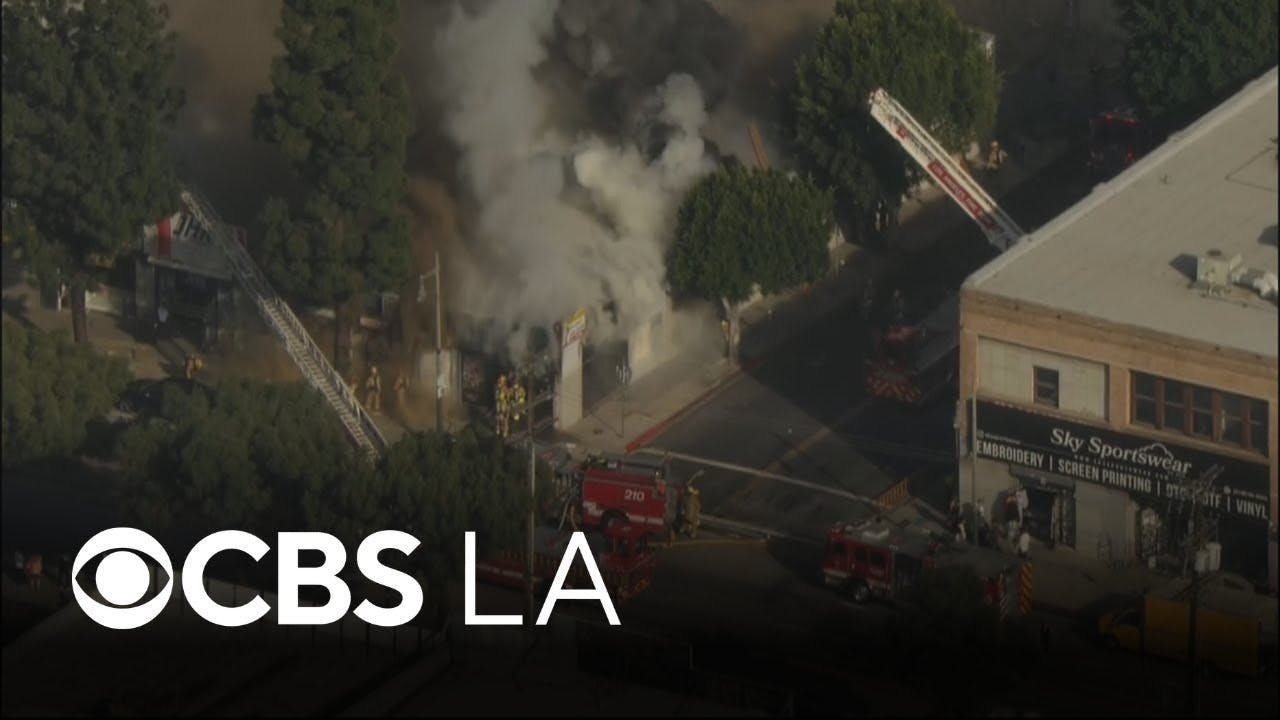 100 firefighters knock down flames at downtown LA business