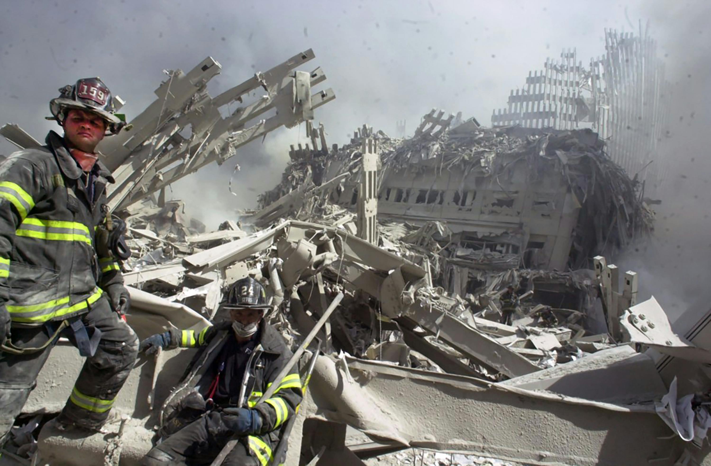 A firefighter searches the pile at the World Trade Center on Sept. 11, 2001.