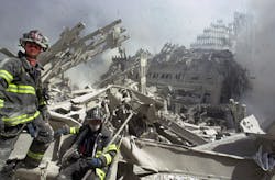 A firefighter searches the pile at the World Trade Center on Sept. 11, 2001. A firefighter searches the pile at the World Trade Center on Sept. 11, 2001.