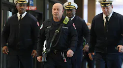 Chicago firefighters arrive at the hearing for the man accused of setting fire where a colleague was killed.