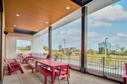 A covered outdoor patio is among the fire station living quarters amenities that were located on the second floor to create separation from other occupants of the building as well as privacy from pedestrian and vehicle traffic. A covered outdoor patio is among the fire station living quarters amenities that were located on the second floor to create separation from other occupants of the building as well as privacy from pedestrian and vehicle traffic.