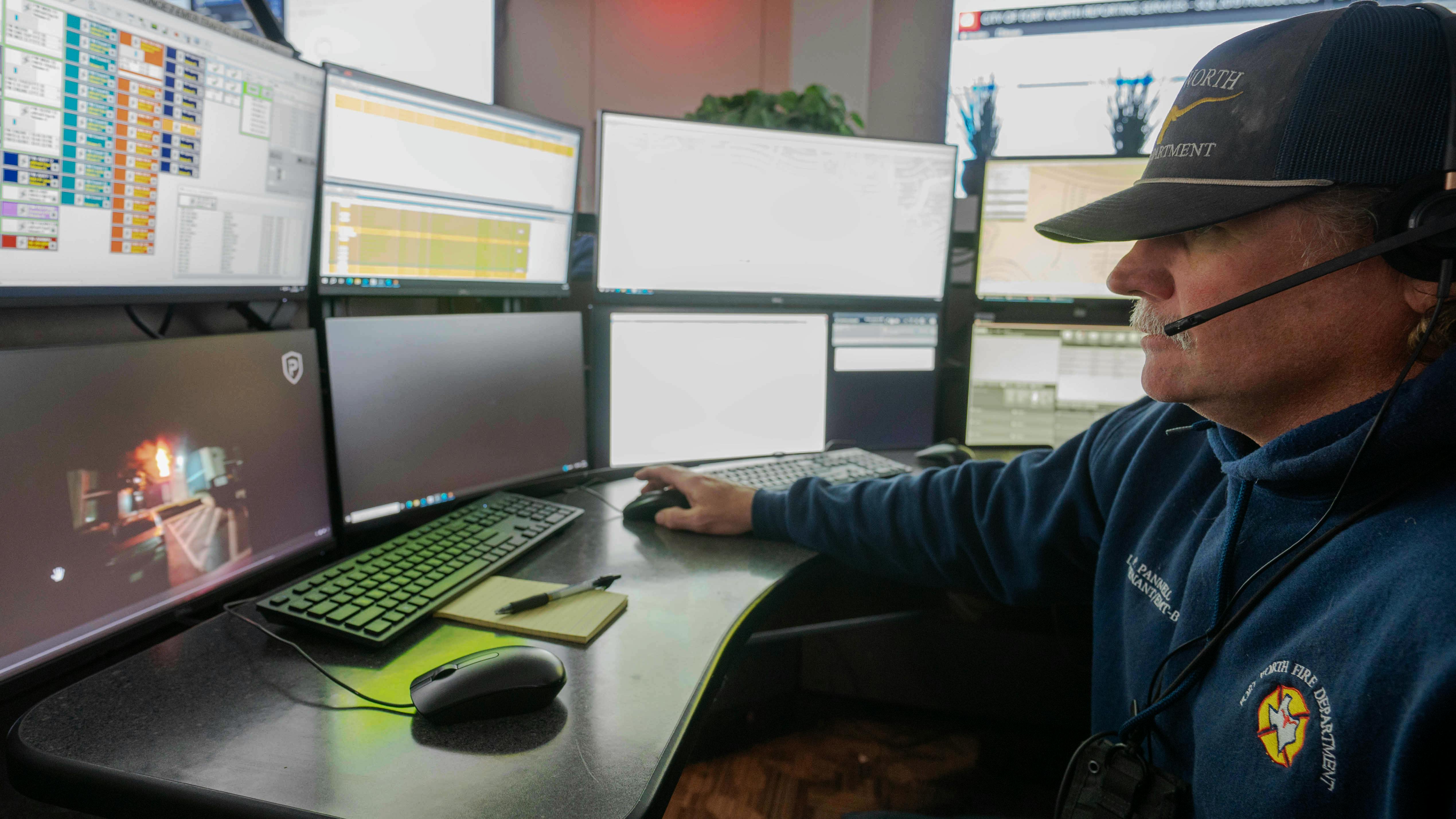 Fort Worth Fire Lt. Jake Pannell watches a live video from the scene of an apartment fire on the city's east side. While Fort Worth call takers are on the line with 9-1-1 callers, they can request them to stream live video so dispatchers can provide better fireground intelligence.