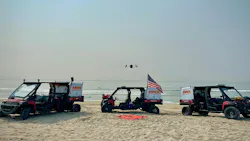 FDNY is among early technology adopters by understanding where technology can help mitigate incidents. Here, a drone hovers among FDNY vehicles that are used in a collaborate effort to prevent drownings at beach in the Borough of Queens. FDNY is among early technology adopters by understanding where technology can help mitigate incidents. Here, a drone hovers among FDNY vehicles that are used in a collaborate effort to prevent drownings at beach in the Borough of Queens.