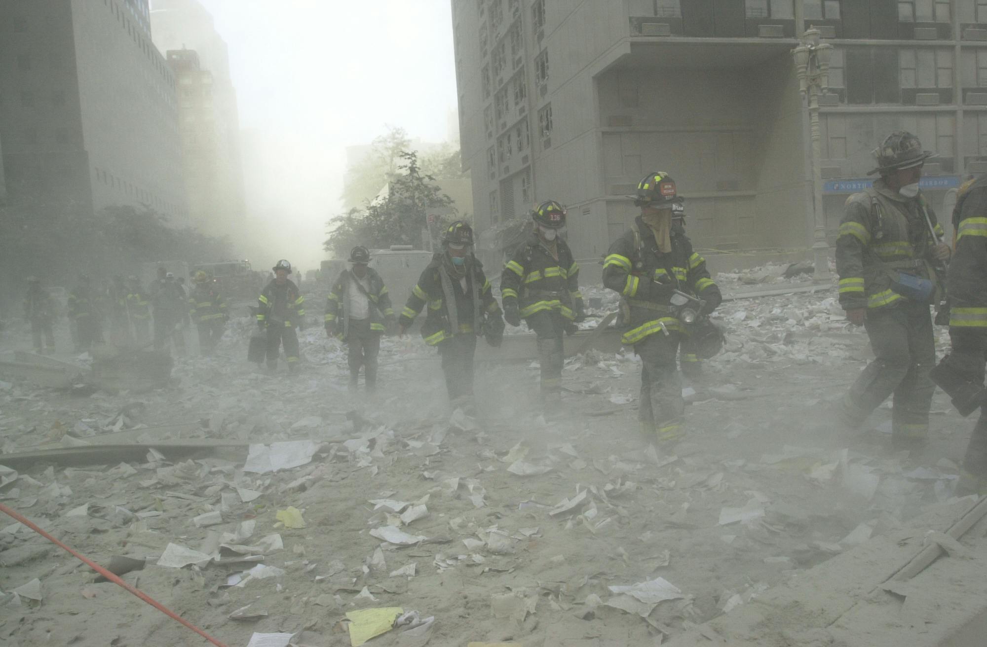 Firefighters search the debris at the World Trade Center after the terrorists' attack.