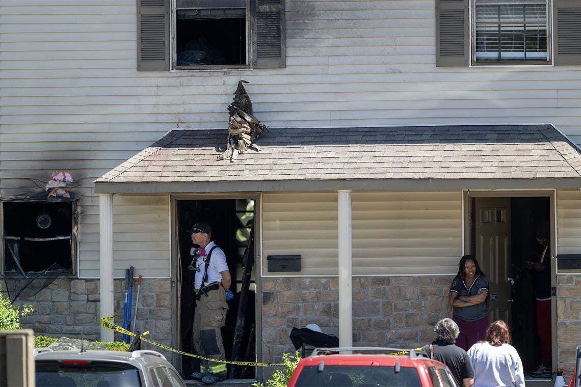 Overland Park firefighters at the scene on an early-morning apartment fire where firefighters rescued several residents Saturday.
