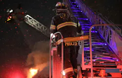 firefighter on aerial ladder firefighter on aerial ladder