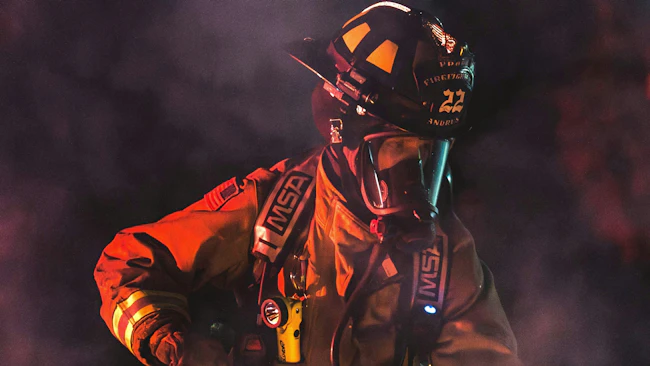 firefighter in SCBA mask on the fire ground
