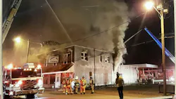 firefighters and aerial ladder truck on scene of restaurant fire firefighters and aerial ladder truck on scene of restaurant fire