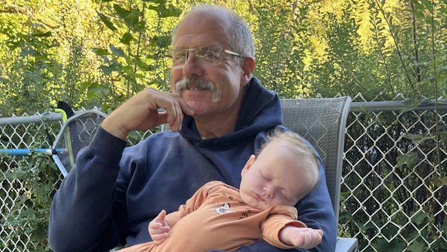 retired fire chief spending time with his grandchild as part of his vision for life after retirement