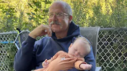 retired fire chief spending time with his grandchild as part of his vision for life after retirement