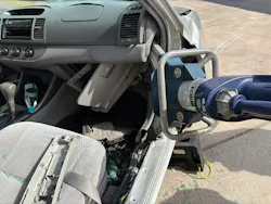 hydraulic spreader in position to displace dashboard of a crashed vehicle to rescue victim hydraulic spreader in position to displace dashboard of a crashed vehicle to rescue victim