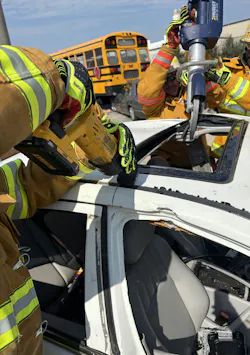 firefighters cutting roof of crashed vehicle to rescue victim firefighters cutting roof of crashed vehicle to rescue victim