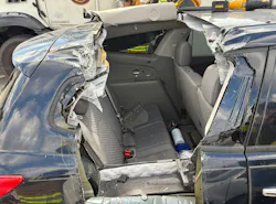 crashed SUV with side rear and roof cut away to rescue victims in third row of vehicle crashed SUV with side rear and roof cut away to rescue victims in third row of vehicle