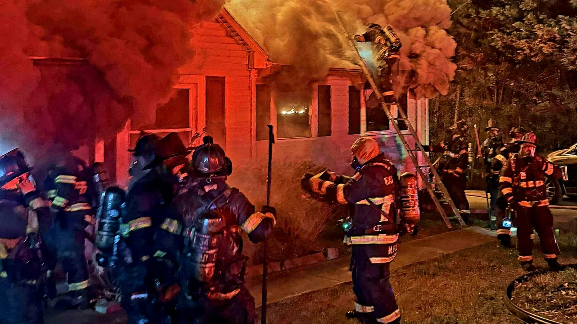 firefighters on scene of a house fire