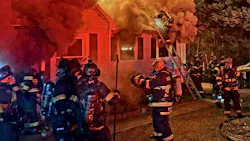 firefighters on scene of a house fire firefighters on scene of a house fire