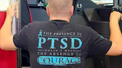 firefighter addressing mental health issues wearing a T-shirt that reads 'The presence of PTSD doesn't mean the absence of courage' firefighter addressing mental health issues wearing a T-shirt that reads 'The presence of PTSD doesn't mean the absence of courage'
