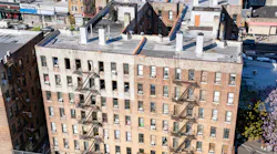The owners of an apartment building in Manhattan where there people died are being sued by New York City for neglecting fire hazards at a neighboring property.