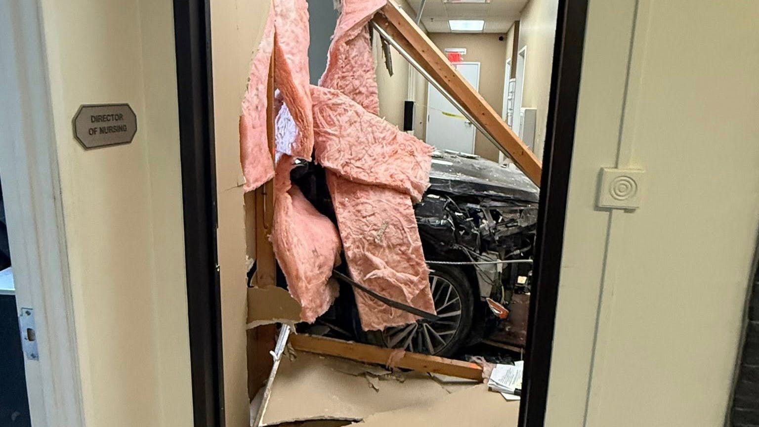 Warrensville Heights firefighters were dispatched a vehicle that struck a building with a person trapped.