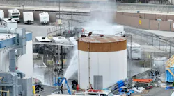 Water is sprayed on a 34,000-gallon tank that overheated at GKN Aerospace in Garden Grove, CA.
