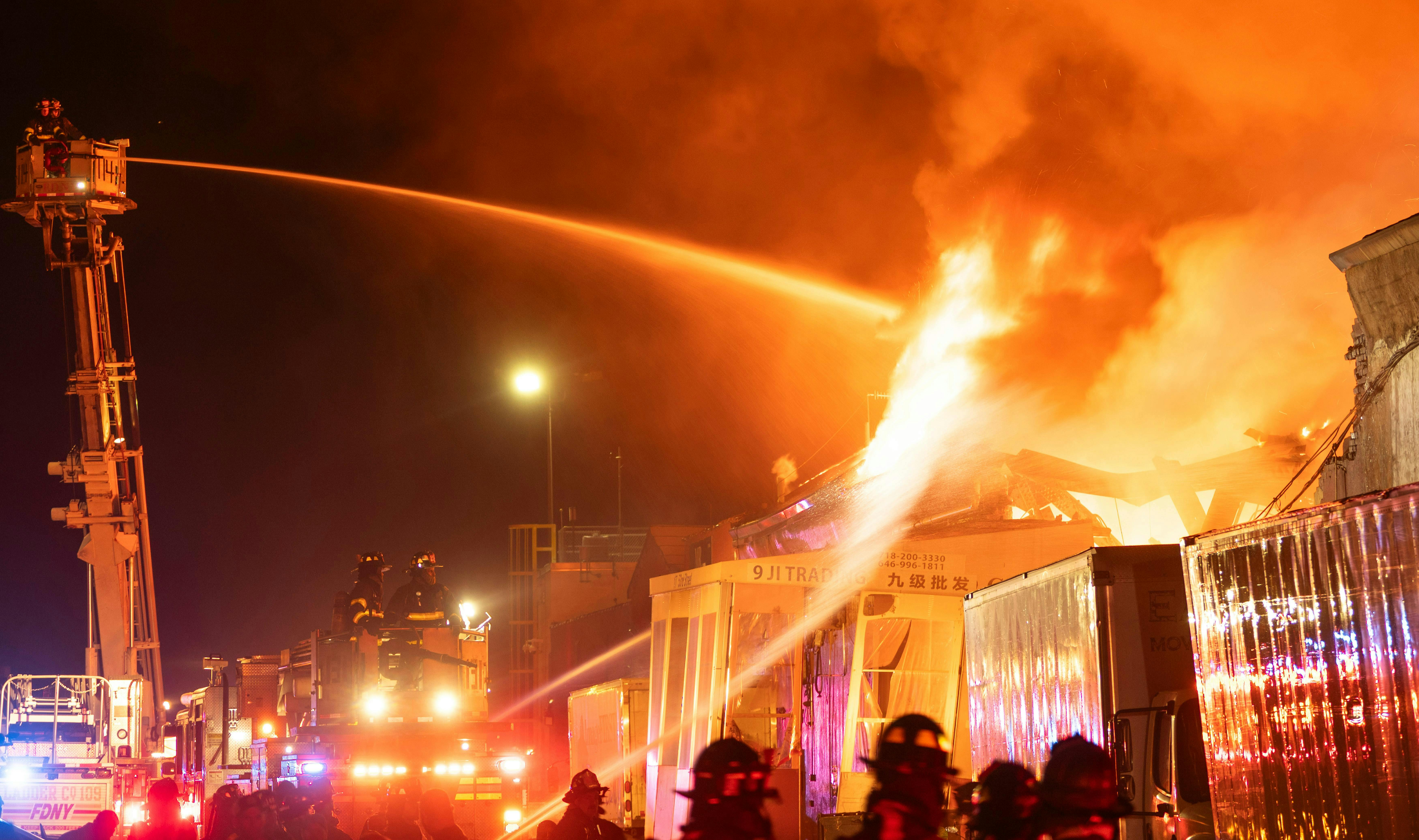 FDNY firefighters commercial building fire five alarms Lloyd Mitchell