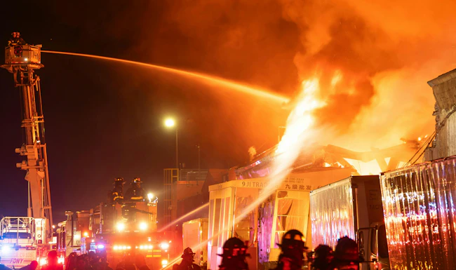 FDNY firefighters commercial building fire five alarms Lloyd Mitchell