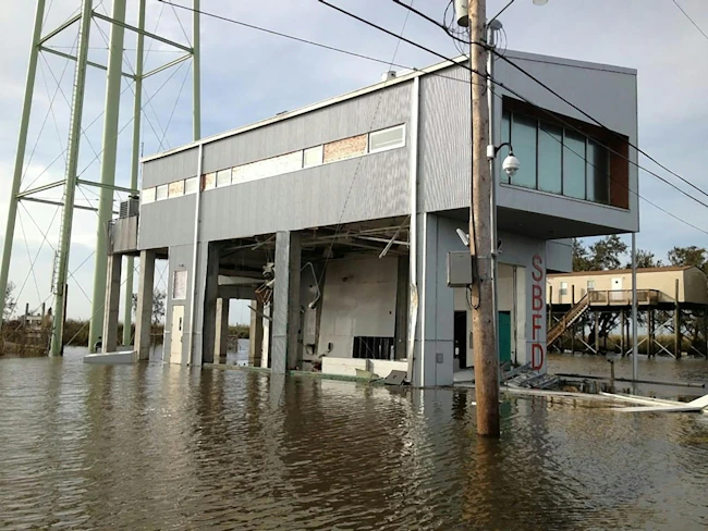 fire station built to withstand a natural disaster standing in flood waters