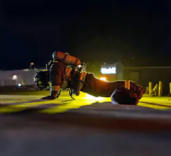 firefighter doing pushups in full firefighting fear