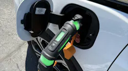 Midtronics xIM-100 EV Immobilizer device inserted into electric vehicle charging port