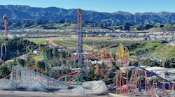 A small brush fire on the perimeter of Six Flags Magic Mountain Thursday prompted the Valencia amusement park to briefly close two roller coasters.