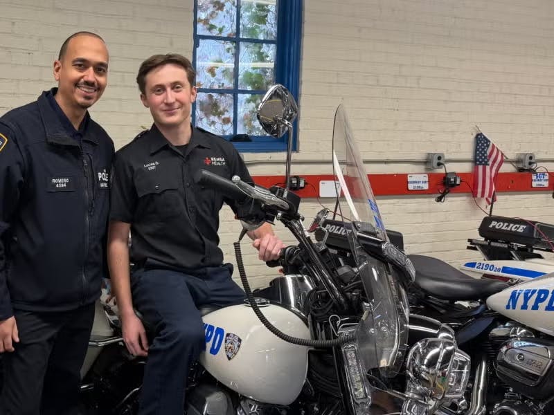 Retired NYPD Sgt. Christopher Romero (left) and Reno EMT Lucas Gorelick, who gave him a future, check out the motorcycles.