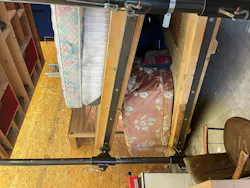 training prop of structural building collapse with upper floor slanted and resting on a manikin training prop of structural building collapse with upper floor slanted and resting on a manikin