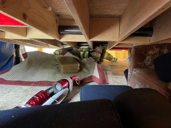 manikin trapped under collapsed floor for rescue training