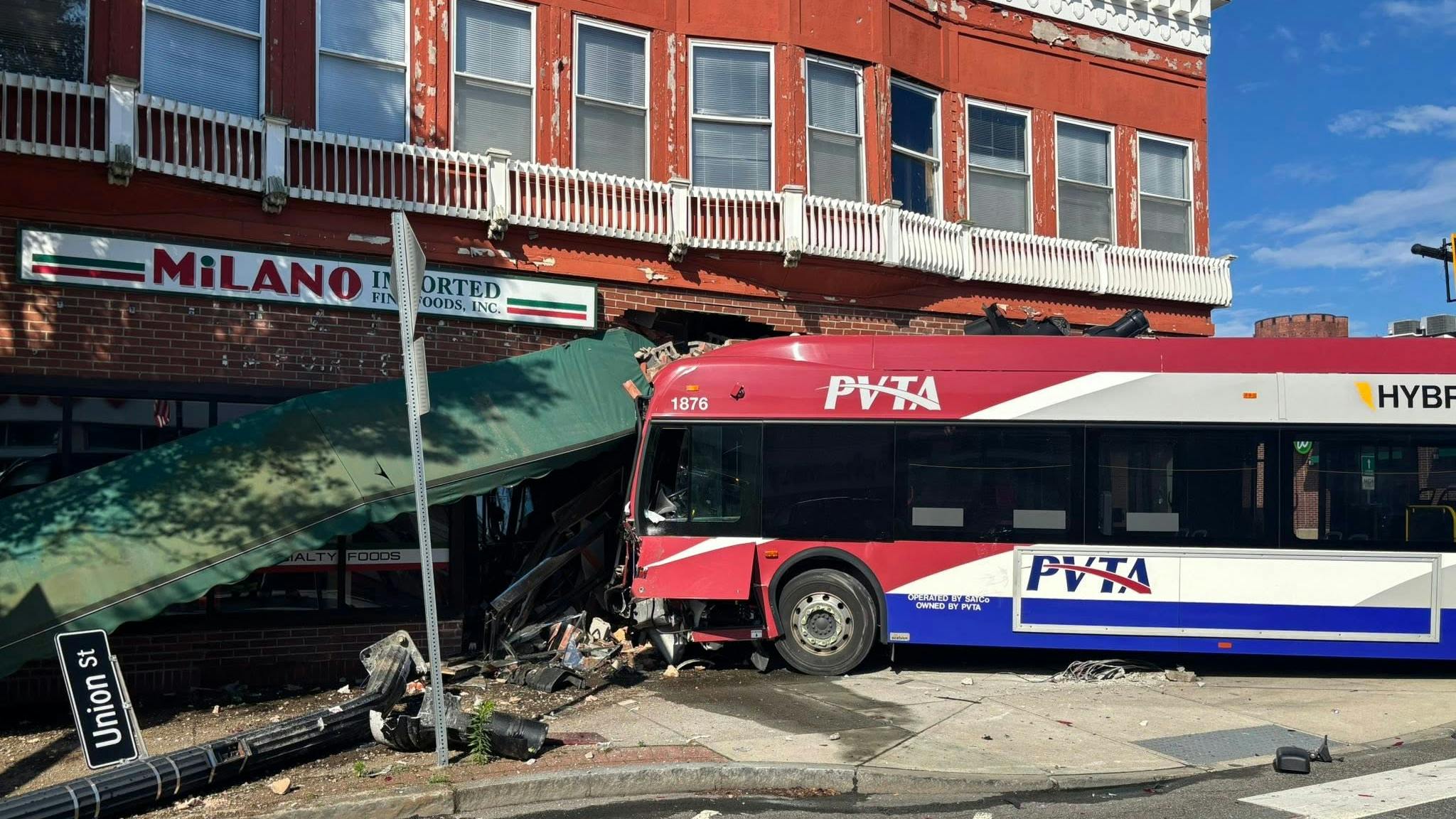 Three people, including the bus driver, were injured when the bus collided and crashed into a downtown Springfield building.